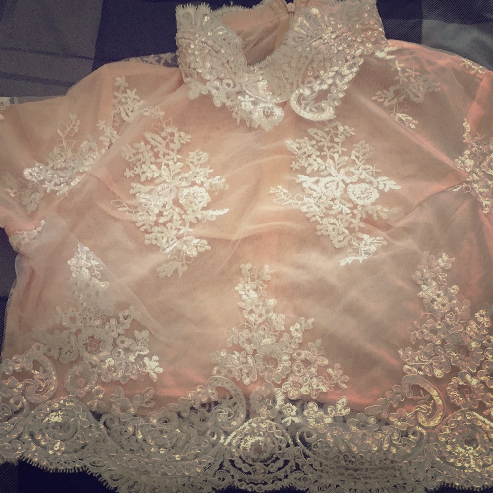 NWOT See through lace and sequin top. Never worn.